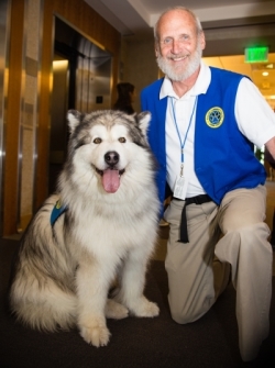 volunteer posing with dog